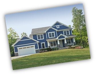 Blue 2 story house with a garage built by Wausau Homes